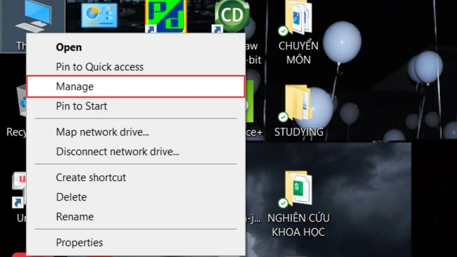 Nhấn chuột phải vào biểu tượng This PC (hoặc My Computer) trên màn hình desktop, sau đó chọn Manage.